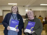 Alison Page and a lady from Age UK holding copies of the report